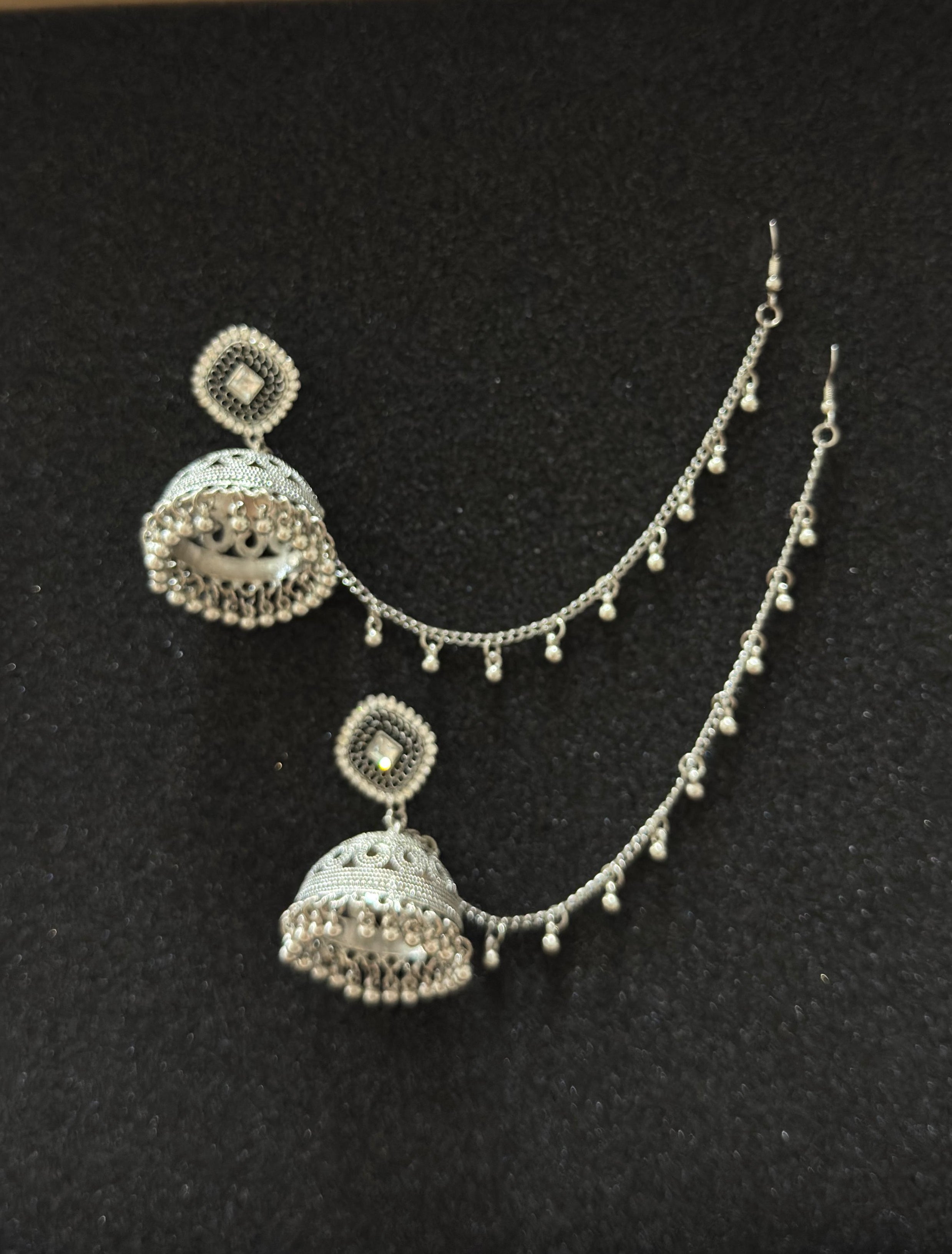 Antique oxidized silver jhumka earrings with decorative sahara chain for traditional Pakistani and Indian outfits.