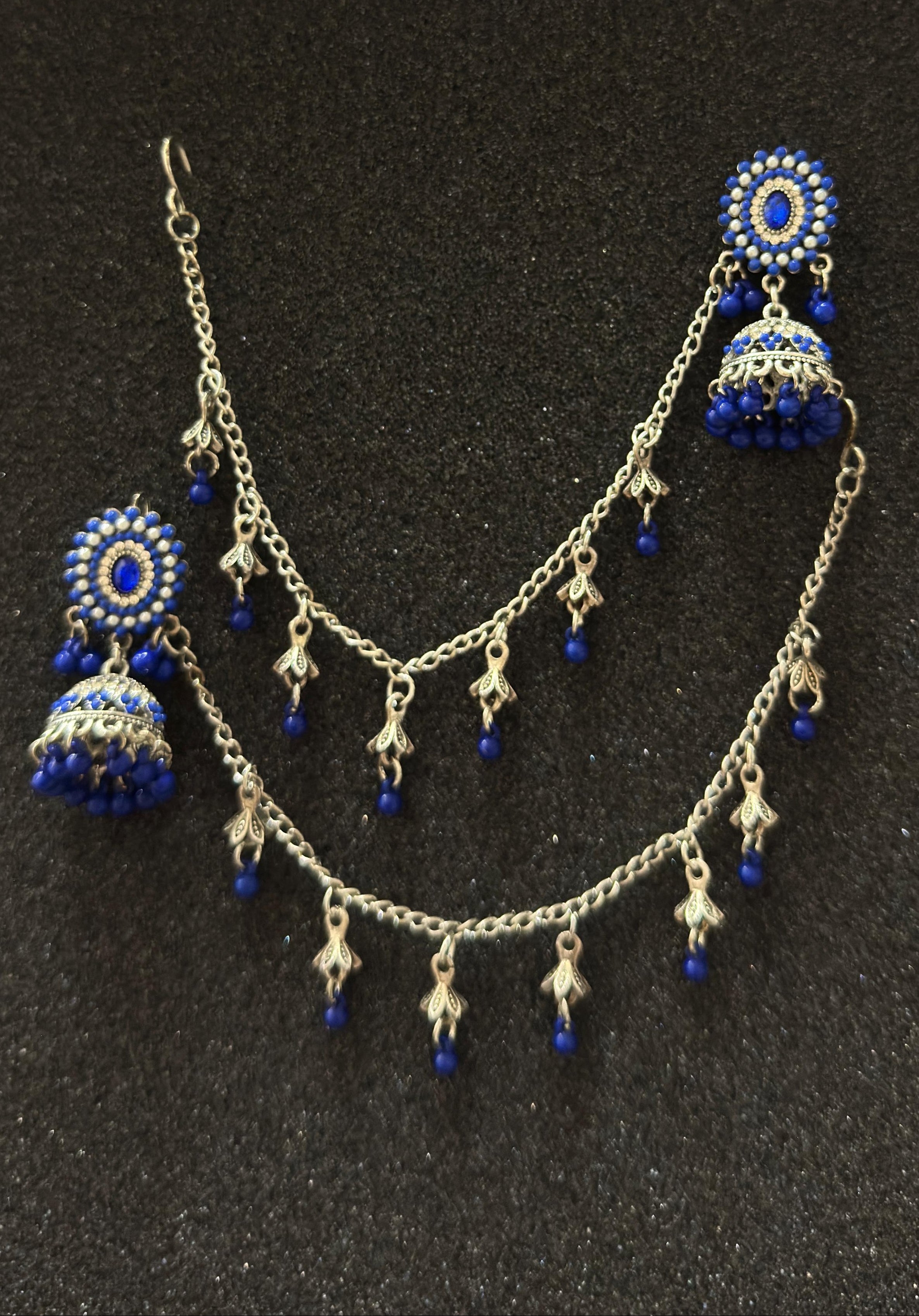 Oxidized silver jhumka earrings featuring sapphire blue stones and matching sahara chain in Canada.