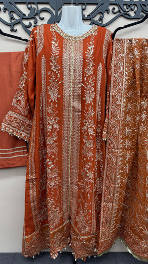 Rust terracotta Pakistani wedding suit with embroidered front