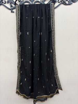 Maryam Qasim Boutique luxury black embroidered maxi suit featuring embellished neckline, matching trousers, and fancy dupatta.