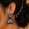 Oxidized silver jhumka earrings featuring sapphire blue stones and matching sahara chain in Canada.