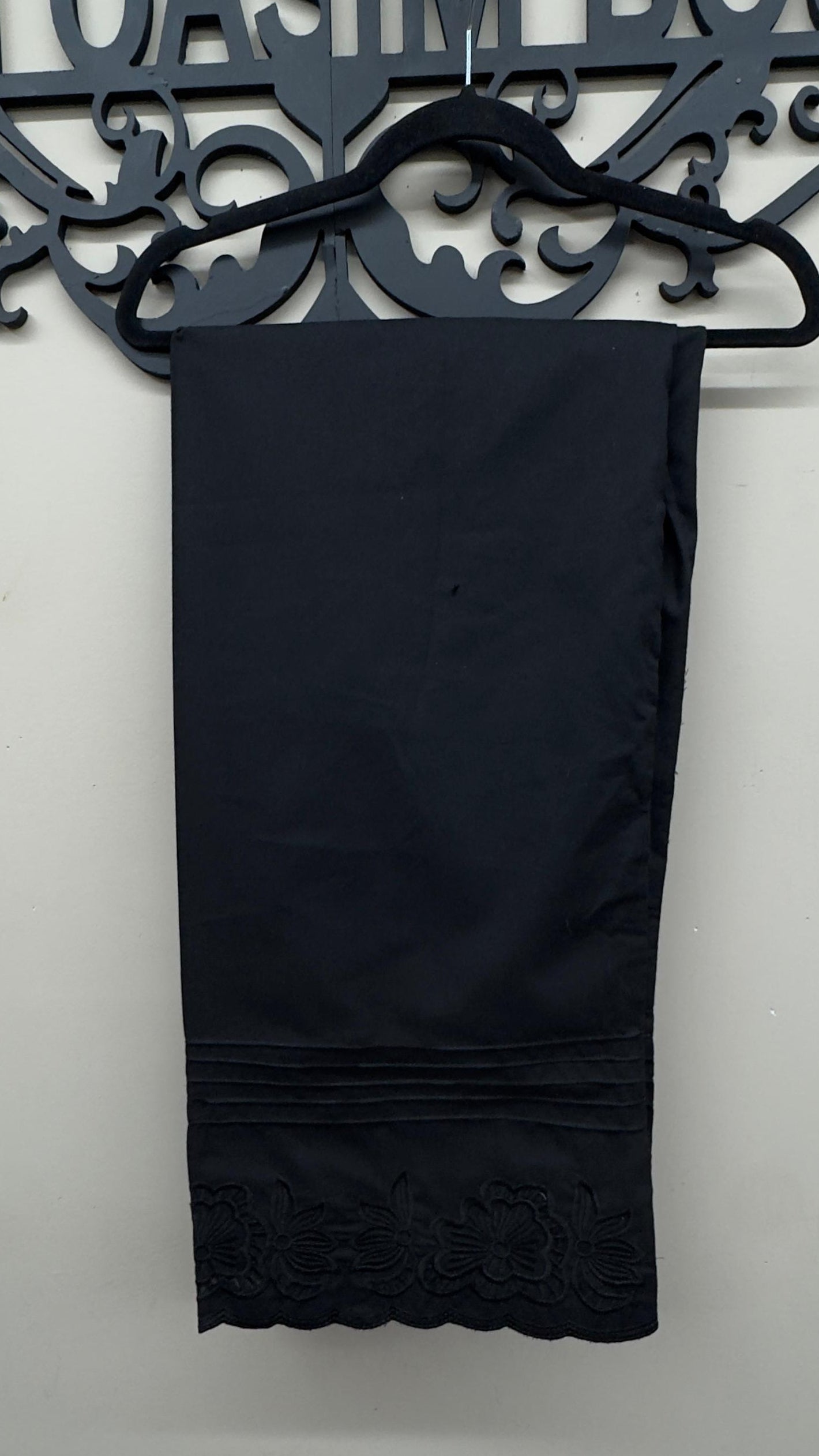 Classic black cotton ethnic trousers paired with South Asian festive wear.