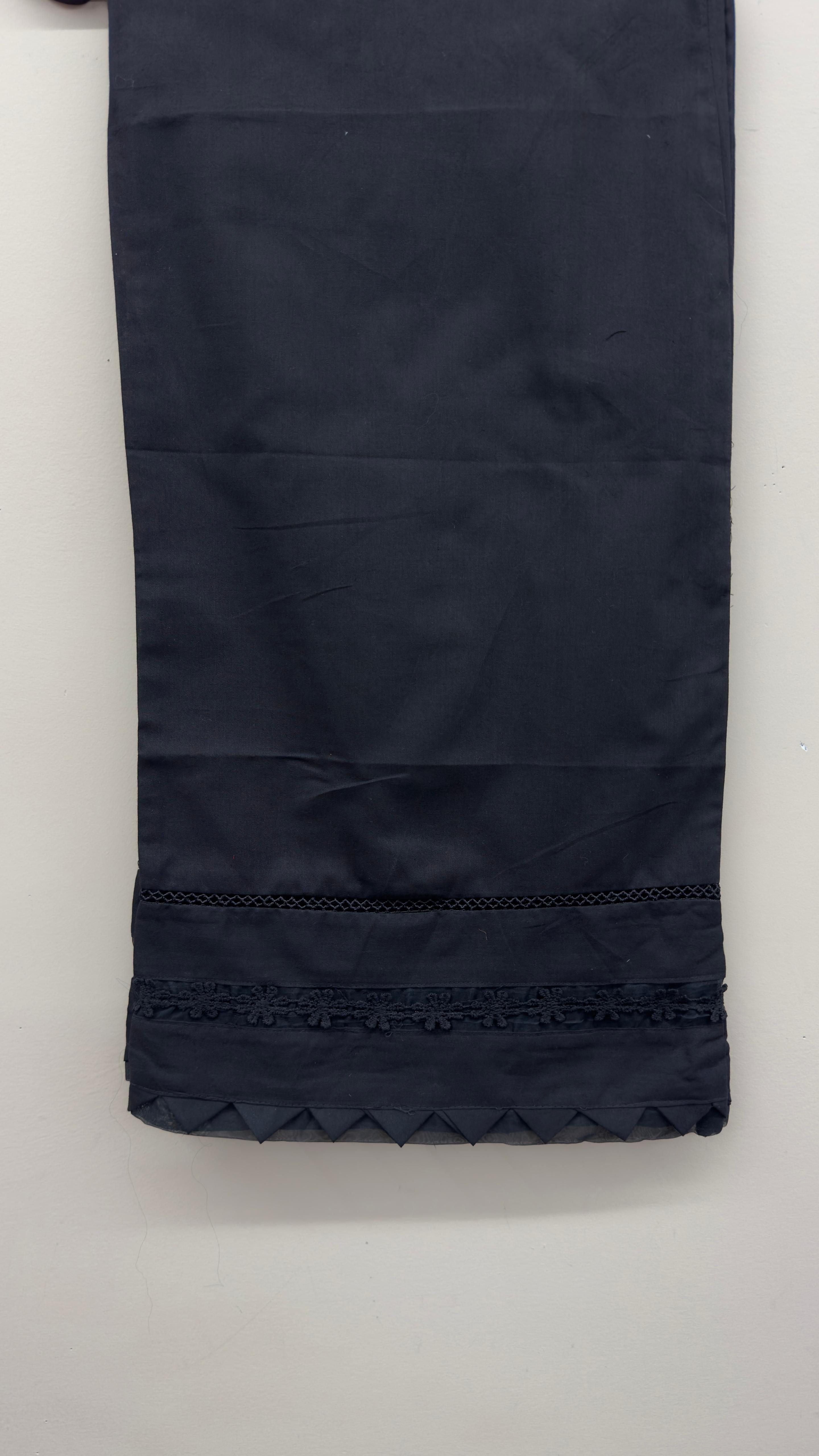 Khaadi black ethnic straight pants styled for South Asian festive wear.
