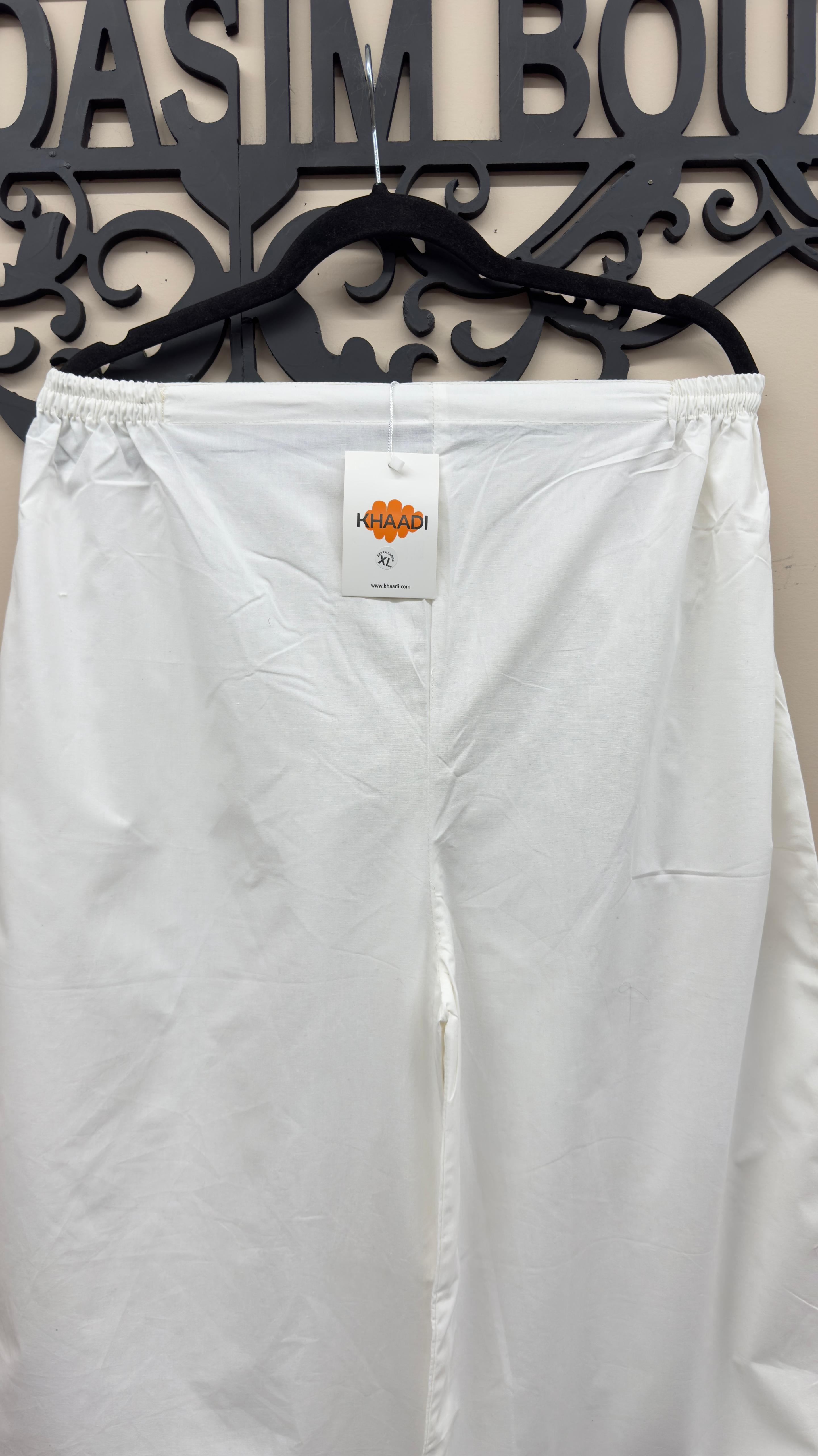 Off-white Khaadi embroidered cotton trousers styled for Indian and Pakistani women's dresses.