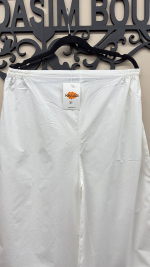 Off-white Khaadi embroidered cotton trousers styled for Indian and Pakistani women's dresses.