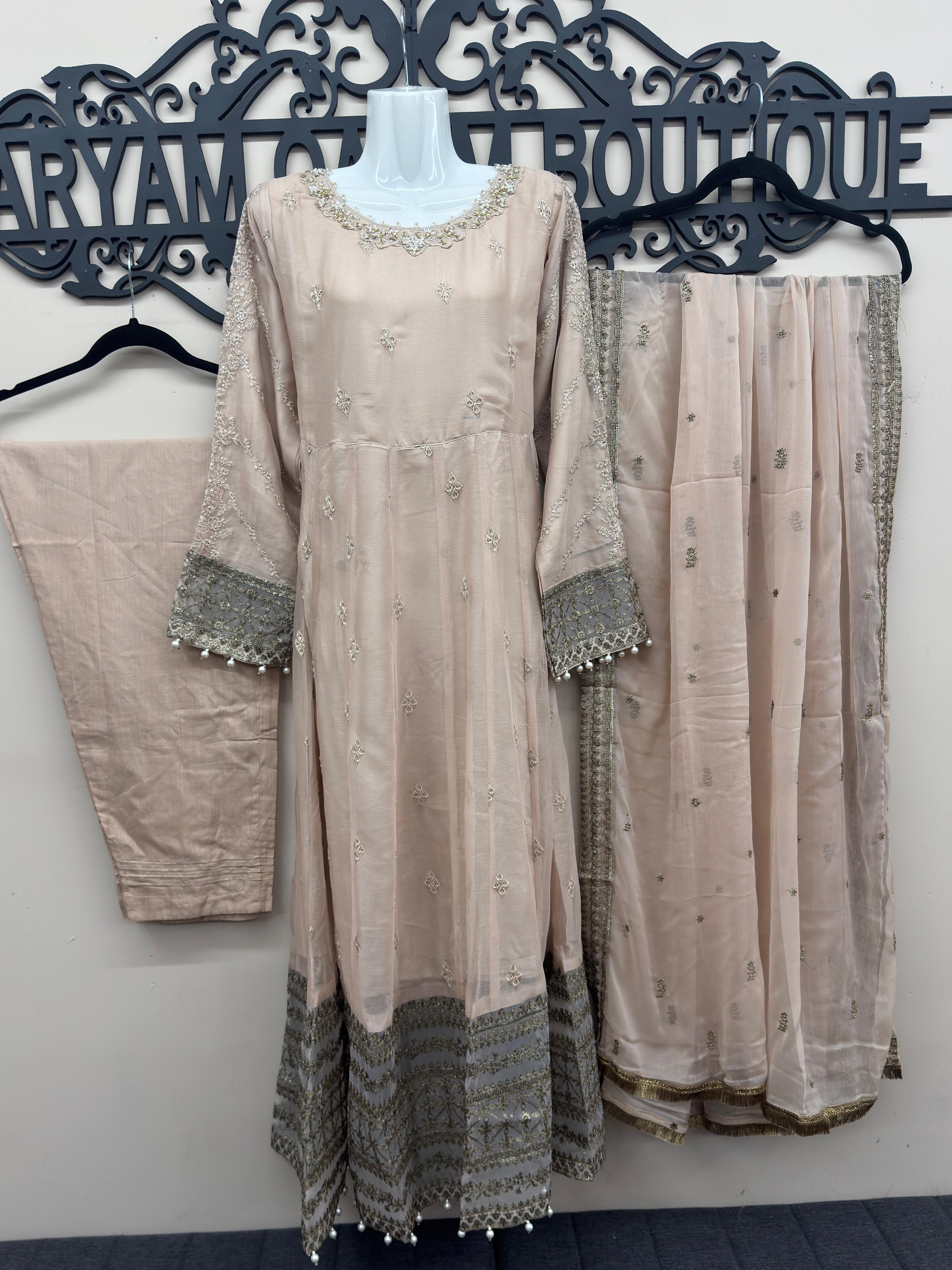 Luxury blush pink 3 piece embroidered maxi dress with matching trousers and embellished dupatta by Maryam Qasim Boutique, elegant Pakistani formal wear for weddings and festive occasions.