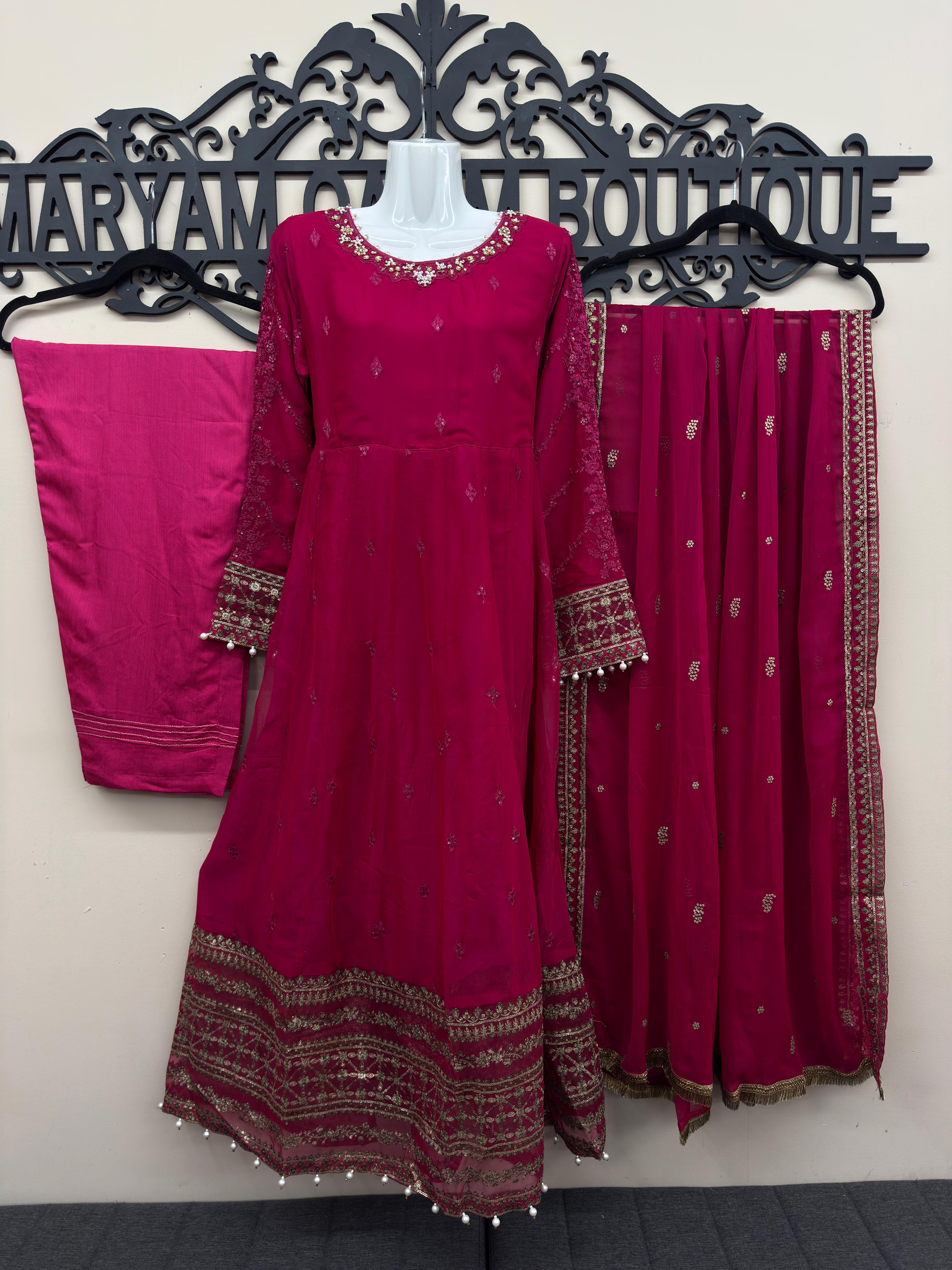 Luxury deep pink 3 piece embroidered maxi dress with matching trousers and embellished dupatta by Maryam Qasim Boutique, elegant Pakistani formal wear for weddings, Eid, parties, and festive occasions.