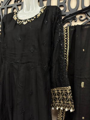 Maryam Qasim Boutique luxury black embroidered maxi suit featuring embellished neckline, matching trousers, and fancy dupatta.