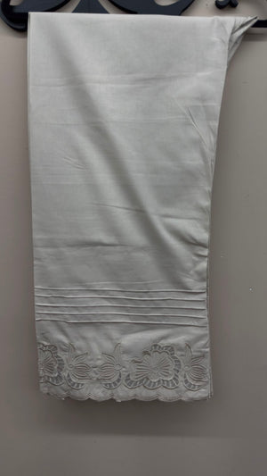 Off-white cutwork embroidered cotton pants styled for Pakistani and Indian women's dresses.