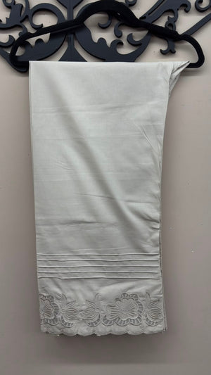 Off-white cutwork embroidered cotton pants styled for Pakistani and Indian women's dresses.