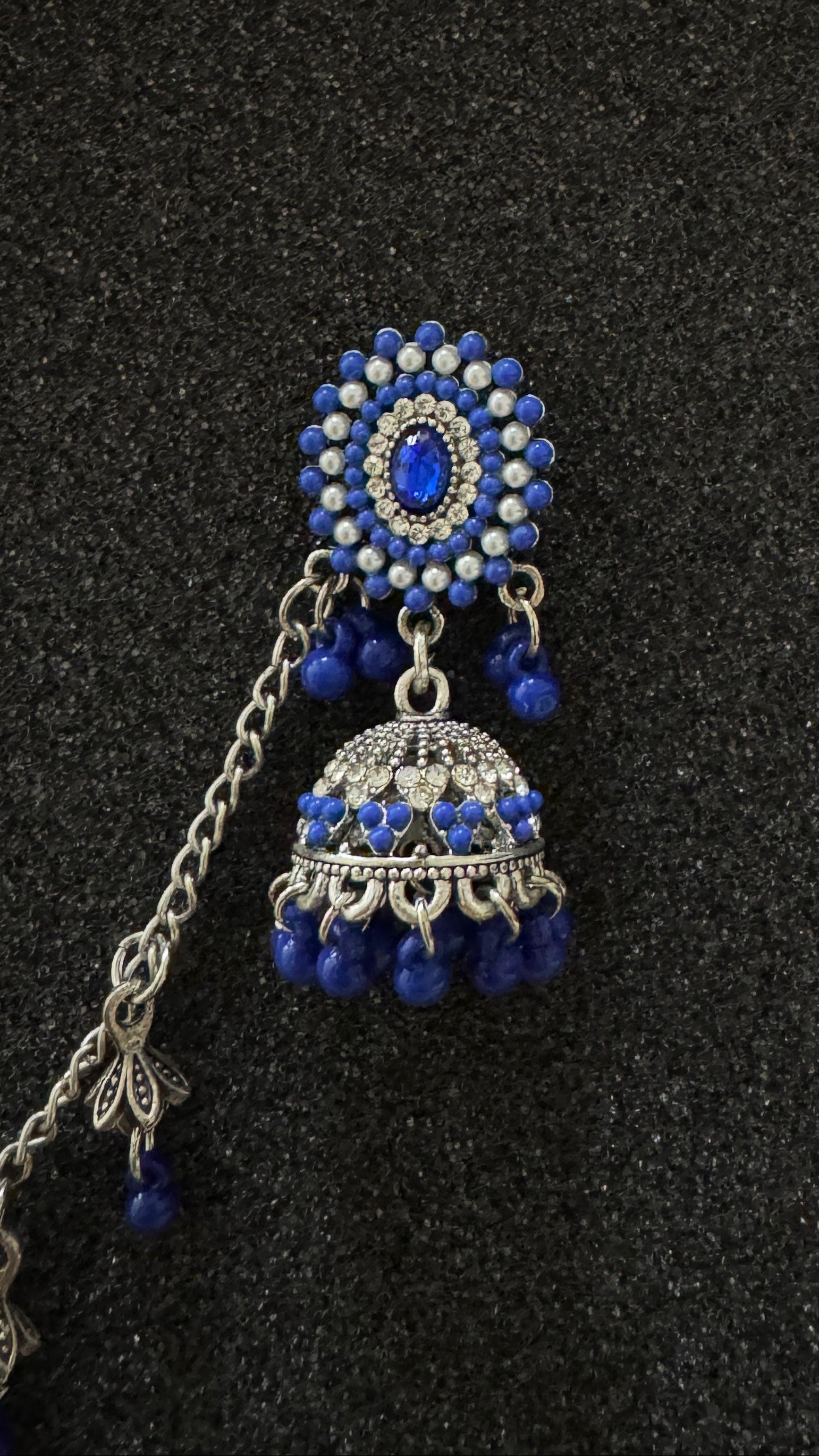 Oxidized silver jhumka earrings featuring sapphire blue stones and matching sahara chain in Canada.