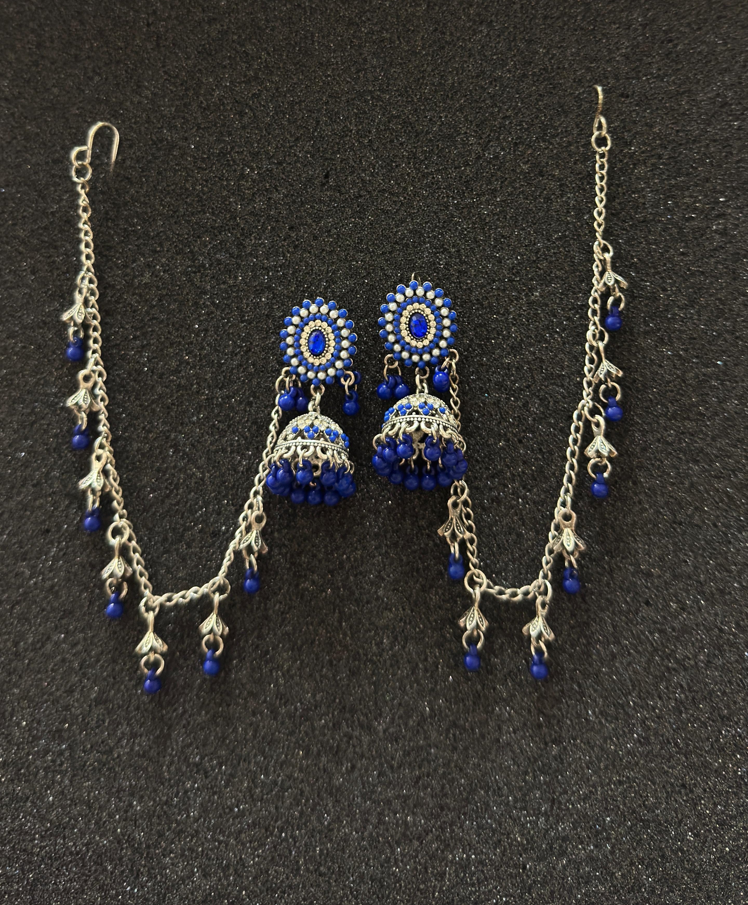 Oxidized silver jhumka earrings featuring sapphire blue stones and matching sahara chain in Canada.