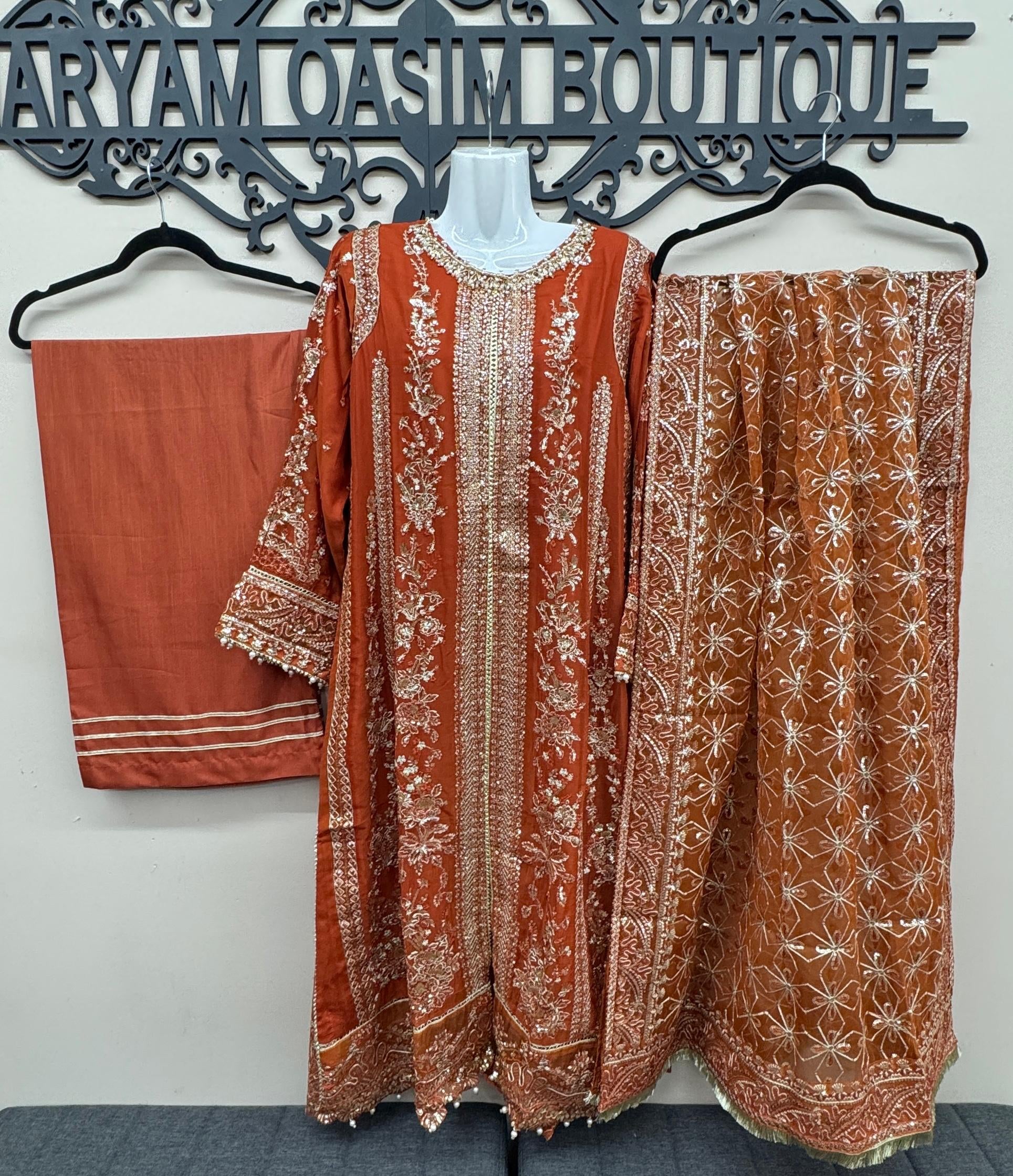 Rust terracotta Pakistani wedding suit with embroidered front