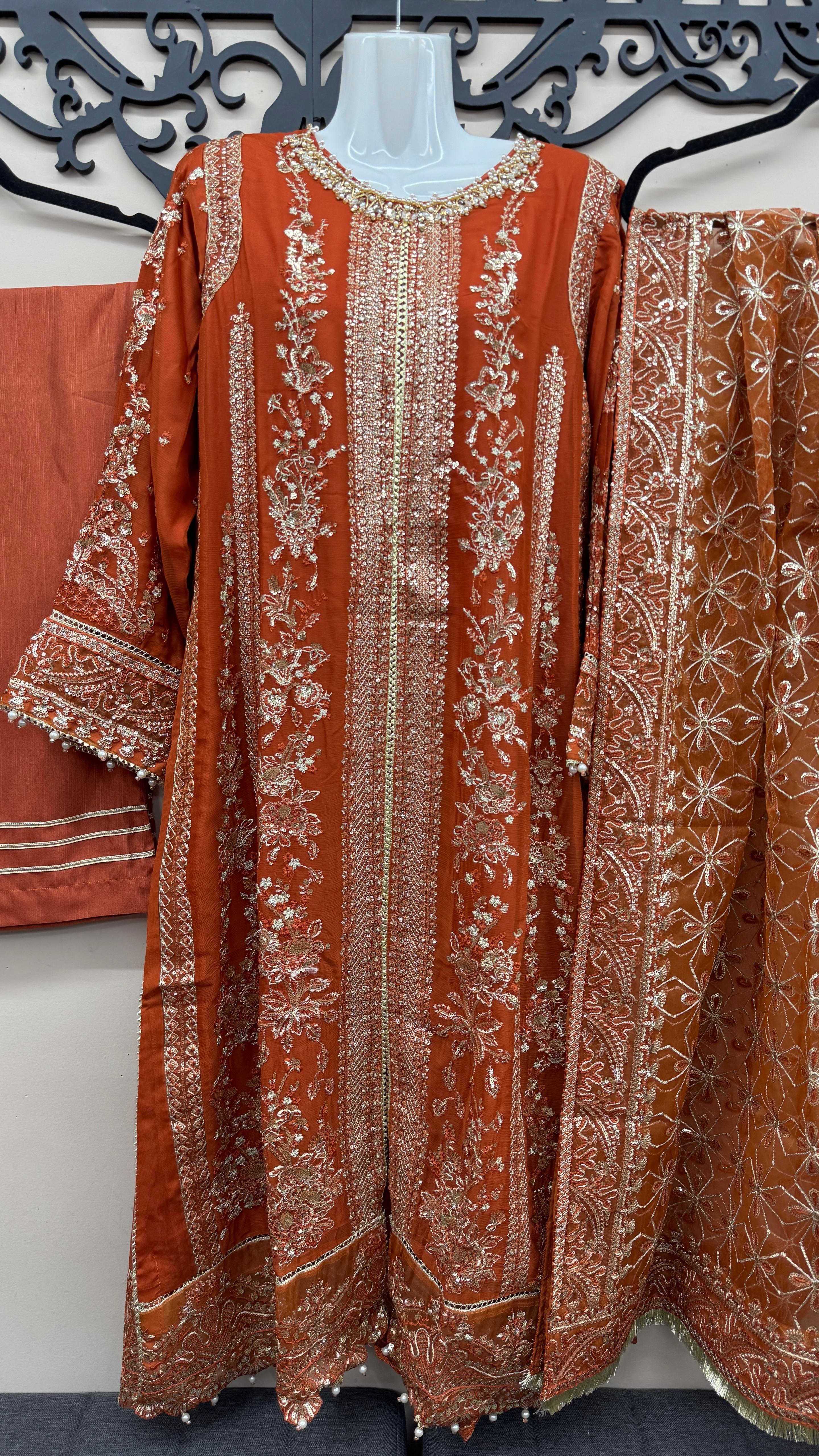 Rust terracotta Pakistani wedding suit with embroidered front