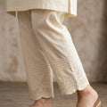 Women's off-white cotton straight trouser with pin-tucks and embroidered motif hem