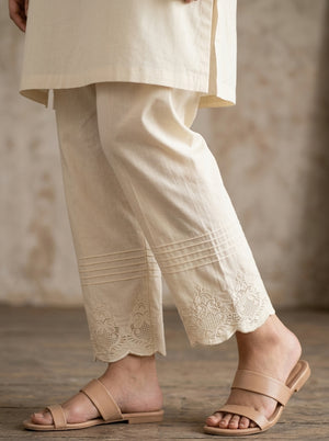 Women's off-white cotton straight trouser with pin-tucks and embroidered motif hem