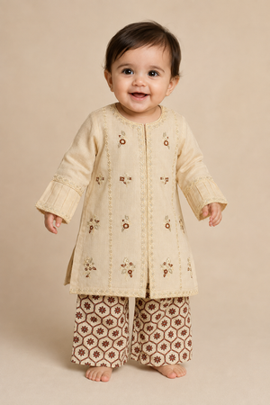 Fancy embroidered cream baby girls 2 piece lawn outfit with brown printed trousers in Canada.
