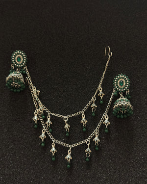 Oxidized silver jhumka earrings with emerald green stones and decorative sahara chain in Canada