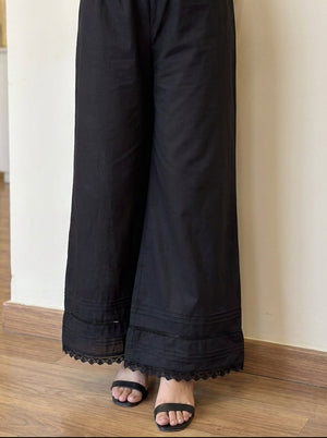 horizontal pin-tuck pleats and scalloped lace trim on Khaadi black pants.