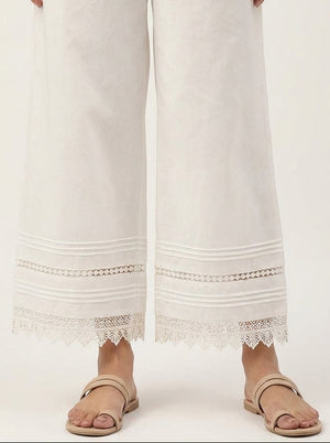 horizontal pin-tucks and intricate scalloped lace border on Khaadi off-white pants.