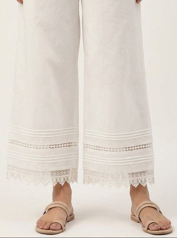 horizontal pin-tucks and intricate scalloped lace border on Khaadi off-white pants.
